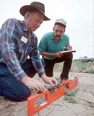 two technicians doing in-field salinity measurement